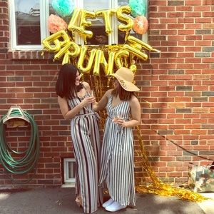 Striped Monteau jumpsuit with slits. Size Medium.